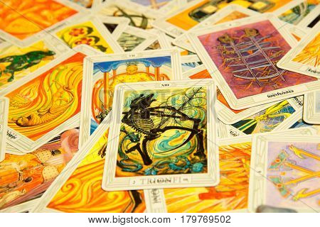 Moscow Russia - December 4 2016: Tarot card Death with other cards. Thoth tarot deck. Esoteric background