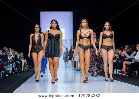 MOSCOW RUSSIA - MARCH 22 2017: Model walk runway for LA REDOUTE & PLUS SIZE MOSCOW catwalk at Autumn-Winter 2017-2018 Moscow Fashion Week. Plus-size fashion models.