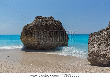 Amazing seascape of blue waters of Megali Petra Beach, Lefkada, Ionian Islands, Greece