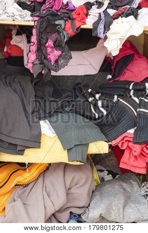 Pile Of Carelessly Scattered Clothes In Wardrobe