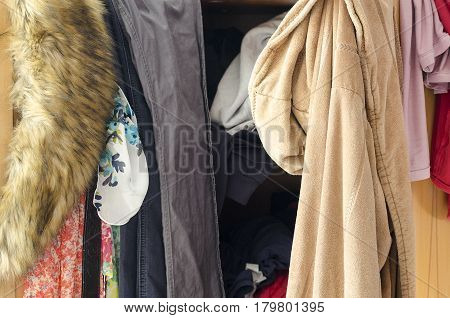 Pile Of Carelessly Scattered Clothes In Wardrobe