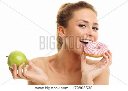 Adult woman posing with donuts over white background