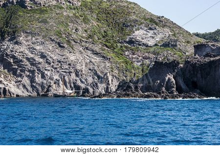 Blue sea and characteristic caves of Cala Luna Golfo di Orosei Sardegna or in Sardinia Italy