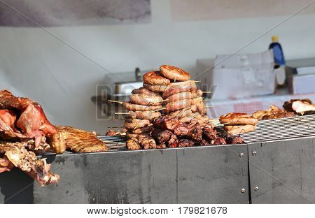 Street Food Stall With Big Grilled Sausages