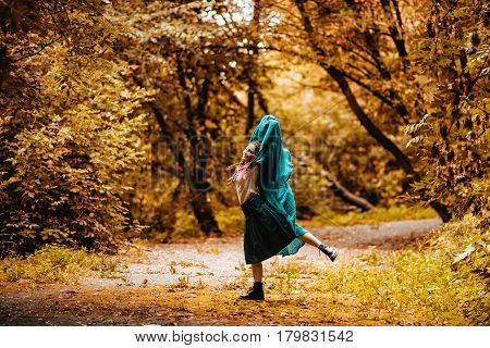 Teenage Girl Walking In Park In Sunny Day
