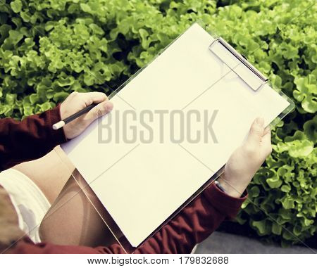Woman cultivated quality check growing