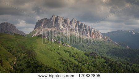 Caucasus mountains (Eastern and Western Acheshbok) under a blue sky with clouds. Caucasus Russia