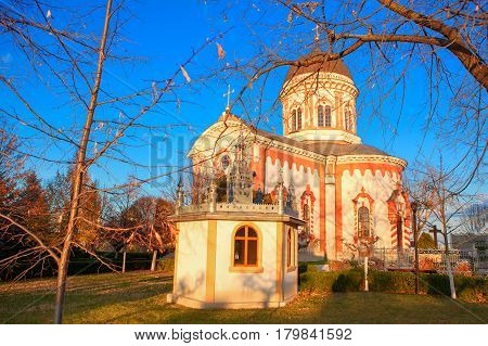 view of church and chapel against blue sky