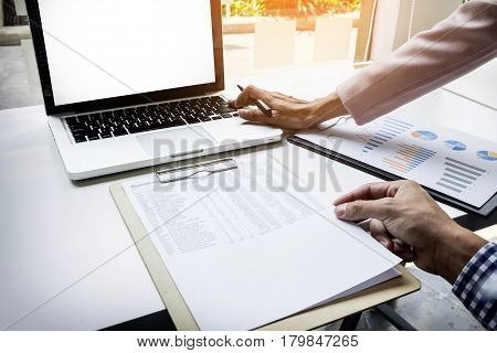 Team Work Process. Young Business Managers Crew Working With New Startup Project. Labtop On Wood Tab