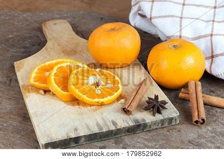 Ripe oranges sliced on oid wood background. Orange in a cut.
