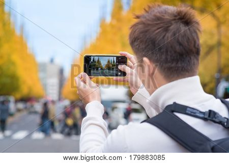 TOKYOJAPAN- NOV 22 :Tourists at Meiji Jingu Gaien in Tokyo Japan on November 22 2016.Meiji Jingu Gaien that has beautiful Ginkgo along the lenght of the street famous for autumn spot in TokyoJapan