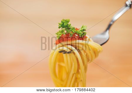 Close-up Of Asta Spaghetti With Tomato Sauce, Olives And Garnish. Italian Food.