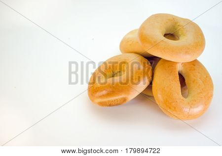 Fresh bagel isolated on white background top view