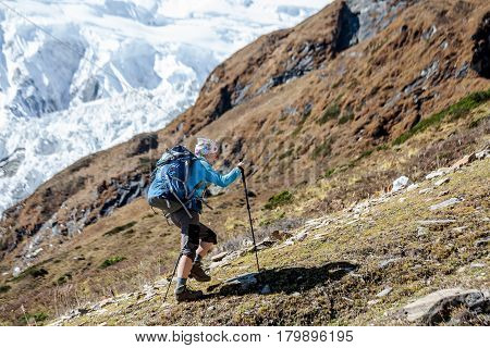 Trekker In Front Of Manaslu Glacier On Manaslu Circuit Trek In Nepal