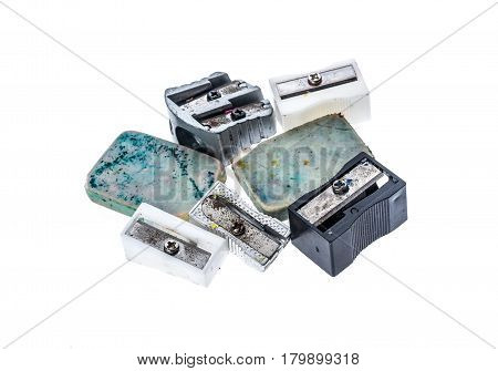 Different Old Used  Pencil Sharpeners And White Rubber Pen Eraser.
