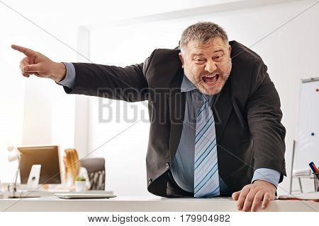 You better go right now. Overwhelmed burned puffy guy loosing his patience and telling his colleague everything he thinking about him