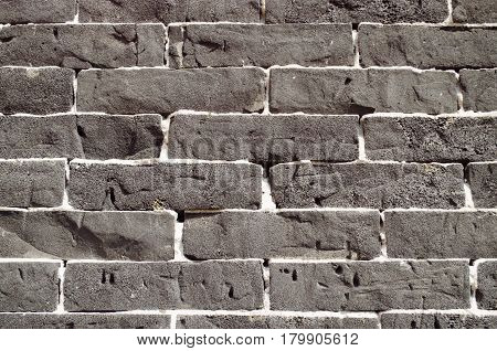 Rough textured wall in black and gray