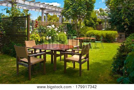 Dining Table Set In Lush Landscaped Garden