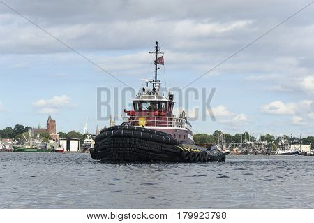 New Bedford Massachusetts USA - August 21 2014: Tug crossing Acushnet River inner harbor in New Bedford Massachusetts