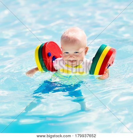 Little Baby Boy Playing In Swimming Pool