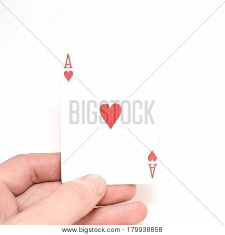 Ace of hearts in a man's hand isolated on a white background