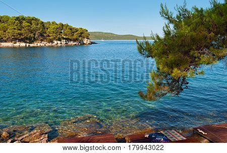 Transparent Deep Blue Sea Water And Rocky Coast