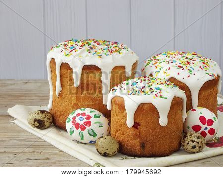 Easter Composition Of Sweet Bread, Paska And Eggs On Wooden Background. Orthodox Kulich. Holidays Br