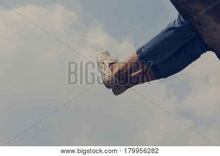 Woman legs sitting and chilling holiday