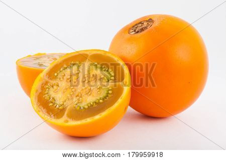 Lulo ( Solanum quitoense ) on white background