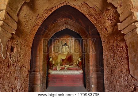 Lord Buddha Sculpture Sitting In Meditation Inside Ancient Temple In Bagan, Myanmar.