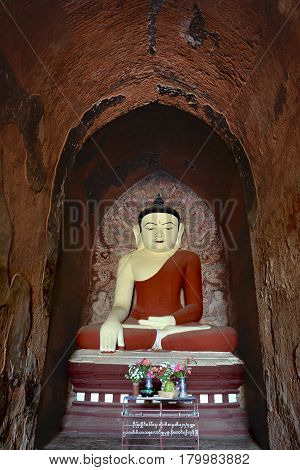 Very Beatiful Smiling Buddha Statue With Altar Inside Old Paya In Bagan, Myanmar.