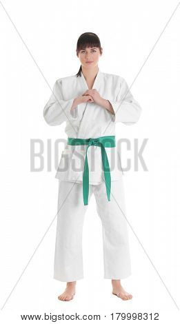 Young sporty woman in kimono on white background