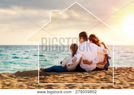 Conceptual Late Afternoon Outdoor Portrait Of Young Parents Sitting On Beach With Kids.foursome Givi