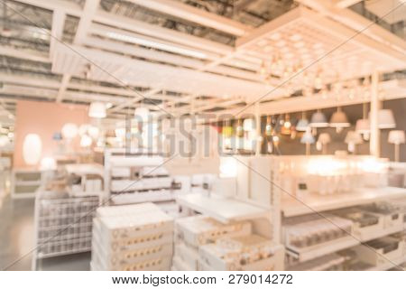 Blurry Background Variety Of Table, Ceiling, Floor Lamps At Furn