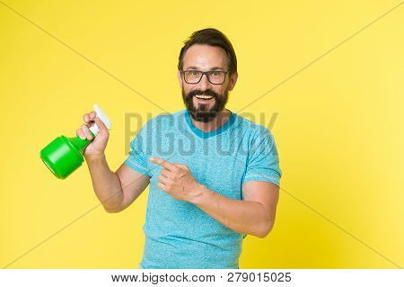 Householding. Single Man With Spray Bottle. Bearded Man. Mature Hipster With Beard. Facial Care. Mal