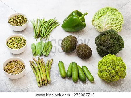 Assorted Green Toned Raw Organic Vegetables On White Background. Avocado, Cabbage, Broccoli, Caulifl