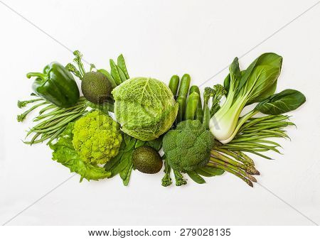 Assorted Green Toned Raw Organic Vegetables On White Background. Avocado, Cabbage, Broccoli, Caulifl