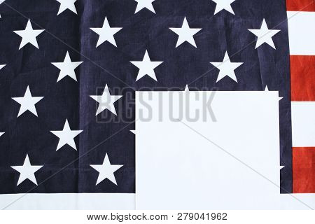 Top View Of Paper On American Flag With Stras And Stripes And Paper With Copy Space