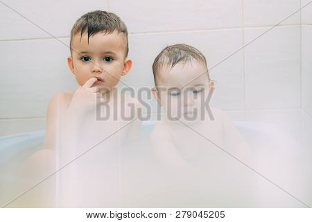 Children, Brother And Sister In The Bathroom Swimming, Playing Splashing