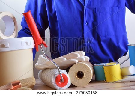 Detail Of A Worker Presenting Paint Products. Horizontal Composition. Front View.