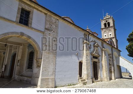 Ancient Church Of The Holy Cross ( Timios Stavros ) Outside Against The Blue Sky. Mountain Village P