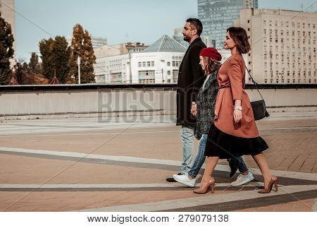 Family Having A Jaunt In The Center Of The City