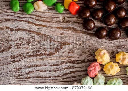 Frame Of Colorful Bright Assorted Candy In Bowls And Jars, Candy Canes And Rainbow Colored Spiral Lo