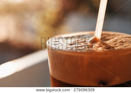 Cold Greek Frappe Coffee With Foam And Vanilla Ice Cream At Sunset