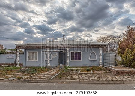 Carnavon, South Africa, September 1, 2018: An Early Morning Street Scene, With A Business In An Old 