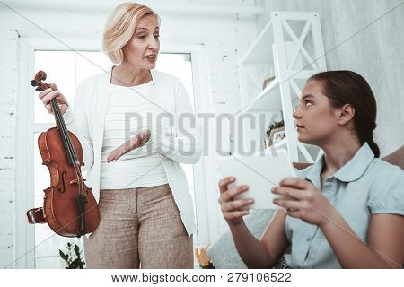 Unhappy Senior Woman Having A Quarrel With Her Granddaughter