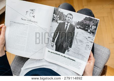 Paris, France - Jan 2, 2019: Woman Reading Article In M Le Magazine Du Monde With Controversial Cove