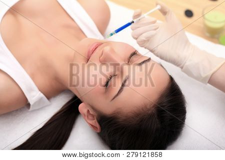 Woman Gets Injection In Her Face. Beauty Woman Giving Injections. Young Woman Gets Beauty Facial Inj