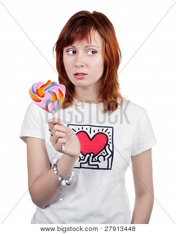 Ragazza dai capelli rossi con un lecca-lecca