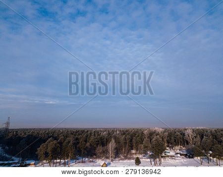 Helicopter Drone Shot. Aerial Photography Of Green Forest With Road, House In Cold Winter Day.